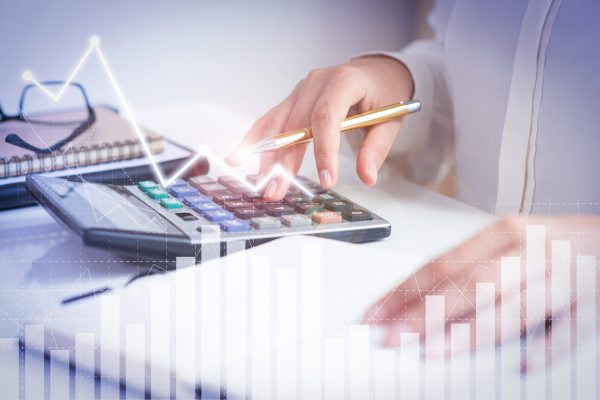 Accountant calculating profit with financial analysis graphs Tax Accounting